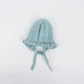 Light blue knit baby hat with ruffle edges and ties, cozy cable knit winter beanie - One Size / Blue