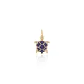 Macro shot of 18K gold turtle pendant with purple enamel shell and zircon stones - Sapphire Blue