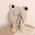 Handmade crochet frog style knit hat for kids with large eyes and ear flaps in beige - One Size / Beige