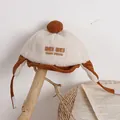 Kinder Wintermütze aus Teddyvlies und Cord in Creme und Braun mit Ohrenklappen - Einheitsgröße / Braun