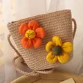 Kids woven straw bag featuring large orange and yellow 3D fabric flowers and a crossbody strap - Hobo Bag / Dusty Pink