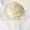 Elegant beige straw boater hat for girls featuring a delicate white lace bow detail - 54 / Beige