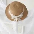 Girl's woven boater straw hat with elegant white lace ribbon and floral bow detail - 54 / Khaki