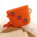 Cute orange woven straw bag for girls with red cherry patches and braided shoulder strap - One Size / Orange