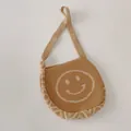 Knitted smiley face crossbody bag for kids in khaki with wave pattern straps - Khaki