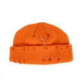 Orange knitted beanie with distressed holes and metallic pin and rings decorations - One Size / Orange