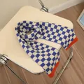 Blue and white checkerboard knit scarf for kids with vibrant orange ribbed edges - Blue Color Blocking Plaid