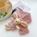 Pink plush kids scarf featuring a soft faux fur rabbit doll and a secure cross design - Dusky Pink