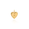 Macro shot of 18K gold plated heart pendant with embossed letter N and radial texture - Letter N Style