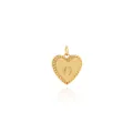 Macro shot of 18K gold plated heart pendant with engraved letter O and grooved edges - Letter O Style