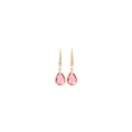 Macro shot of 18K gold plated earrings featuring pear-cut pink crystals and small pearls - Watermelon red