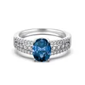 Luxurious S925 silver ring featuring an oval blue zircon and three rows of clear side stones - Oval Deep Blue Main Stone Style (DY121138)-Size 5