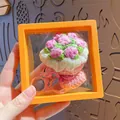 Pink handmade crochet flower bouquet keychain presented in an orange floating display case - Pink Rose (with Orange Suspension Box)