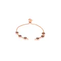 Detail of adjustable rose gold bracelet with six smoky brown round faceted gemstones - Coffee