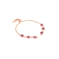 Détail d'un bracelet bolo en or rose avec six zircons magenta et un fermoir ajustable - Bordeaux