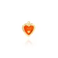Macro detail of heart-shaped 18K gold-plated locket with red Sweet engraving - Red