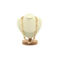 18K gold-plated chunky link necklace with textured rings and knot details on a bust stand - Gold