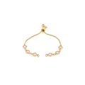 Detailed view of an 18K gold plated adjustable slider bracelet with pink gemstones - Light Purple
