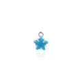 Detailed view of an 18K gold-plated star pendant with a light blue zircon center stone - Turquoise