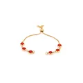 Detailed view of adjustable 18K gold-plated bracelet with six circular red gemstones - Red