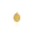Macro view of a 18K gold-plated oval locket with yellow heart patterns and embossed details - Yellow