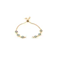 Detail of 18K gold plated adjustable bolo bracelet with six bezel-set blue zircons - Aqua