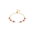 Detail showing an 18K gold plated box chain bracelet with six purple gemstones and slider - Rose Red
