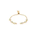 Detail of adjustable gold-plated bracelet featuring six round light green bezel-set stones - Yellow-Green