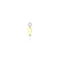 Macro detail of teardrop gold pendant with yellow gemstone and zircon setting - Yellow
