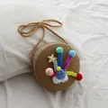 Mini bolso bandolera de paja para niña con pompones coloridos y estrella de lentejuelas - Caqui