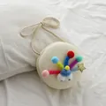 Bolso bandolera redondo tejido blanco crema con pompones de colores y ojos para niñas - Crema