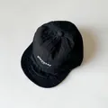 Minimalistische zwarte katoenen kinderhonkbalpet met witte Discover borduring - Zwart