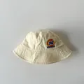Beige cotton kids bucket hat featuring a vintage 74 Holiday letter print for sun protection - Beige