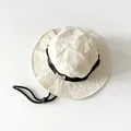 Kids beige sun hat with wide brim, black adjustable chin strap and minimalist logo - White