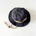 Kids black outdoor bucket hat with khaki trim and adjustable chin strap for sun protection - Black