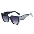 Modieuze cat eye zonnebril met diepblauw en grijs patchwork montuurontwerp - Blauw Frame / Grijs Verloop
