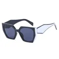 Modern geometric cat-eye sunglasses with bold black and white frames and grey lenses - Black White / Grey