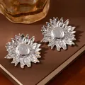 Chic silver sunflower stud earrings with layered metallic petals on a vintage book - Silver Sunflower Hammered Floral Earrings (S2318-1)