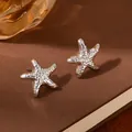 Polished silver starfish stud earrings with hammered metal texture for a minimalist ocean style - Silver Starfish Hammered Texture Earrings (S2388-1)