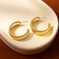 Golden C-shaped hoop earrings with vertical ribbed texture and minimalist aesthetic - Golden Ribbed C-Hoop Earrings (H2520-1)