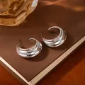 Chic silver tiered hoop earrings with wavy texture on a minimalist brown background - Silver Thick Shiny C-Hoop Earrings (H2555-1)