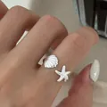 Bague ajustable en argent 925 avec motifs marins de coquillage et étoile de mer - Style Océan Coquillage Étoile de Mer (J7223)