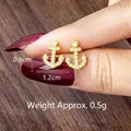 Golden anchor earrings with rhinestones measuring 0.9cm height and 1.2cm width - Anchor Style Stud Earrings (E3065)