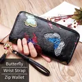 Long leather wallet for women with black pebble grain and colorful butterfly relief design - Butterfly