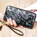 Black leather long zip wallet with silver-green rose embossing and wristlet strap - Silver Rose
