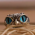 Vintage owl ring with detailed silver feathers and striking blue crystal eyes - Blue Vertical Eye Owl