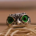 Vintage owl ring in silver finish with vibrant green gemstone eyes and feather texture - Green Round Eye Owl