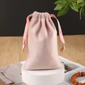 Pink velvet jewelry pouch with satin drawstring closure on white display stand - Light Pink