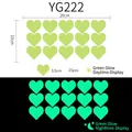 Luminous heart-shaped wall stickers showing day and night green glow effects, 15 pieces - YG222