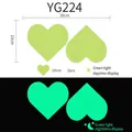 Luminous heart wall stickers YG224 showing day and night glow effects in green - Yg-224 [2 Hearts]